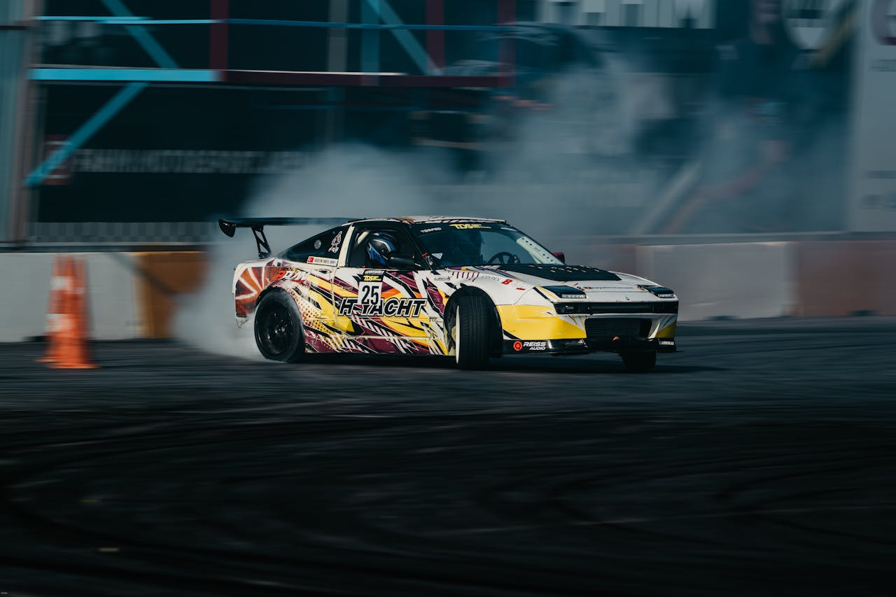 Exciting drift racing car performing on track with smoke effects, vibrant colors, and high speed.